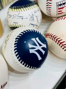New York Yankees logoed baseball, various baseballs