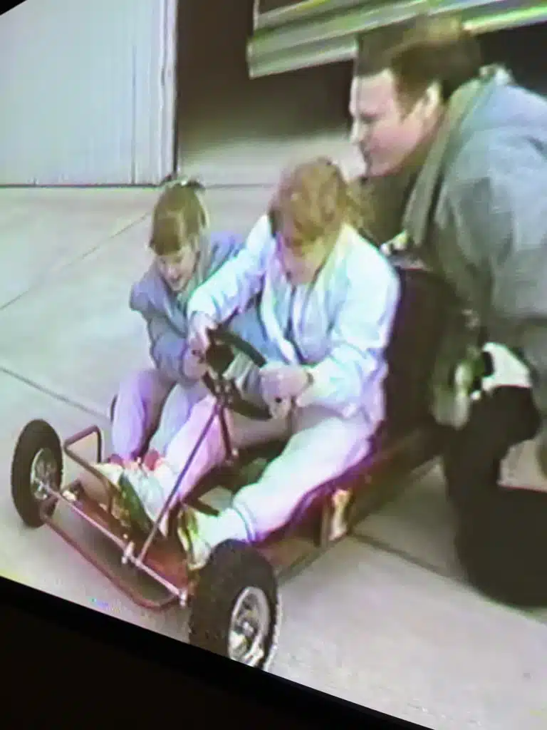 Dad, daughters, go-cart