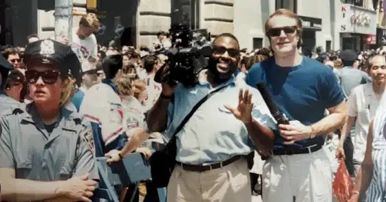 photographer, reporter, parade route, police officer, crowd